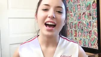 Slender dark haired cheerleader Daisy Haze plays inside her vagina with