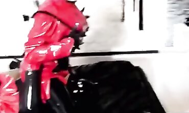 Lexi Dark Enjoys a Wild Rubber Orgy Session