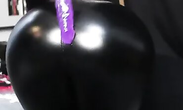Noel Hawk Drills Herself in Glossy Leather Yoga Pants