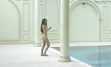 Irina Russaka Strips Nude for a Solo Pool Swim