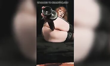 Audrey Hollander Plays with a 10-Inch African Toy