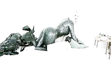 Blonde Dom in Rubber Catsuit Plays with Vinyl Fucktoy