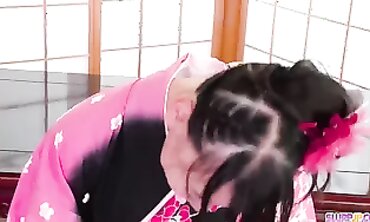 Japanese Brunette in Kimono Receives Oral Pleasure at Home