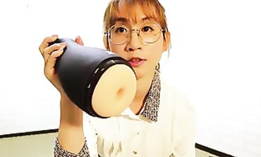 AB046 Asian Secretary Unboxes and Tests a Fresh Masturbation Machine