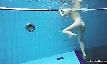 Brunette Milana Voda Swims Nude in the Pool