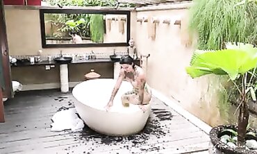 Tattooed Russian Babe Takes Deep Throat in Hot Bath