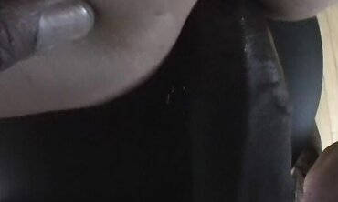 Melissa Lauren Looks Into The Camera As She Munches And Fellates A Ebony Man Rod