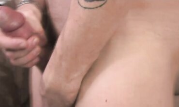 Inked boy with lengthy fears and Prince Albert piercing jacks himself in bedroom.