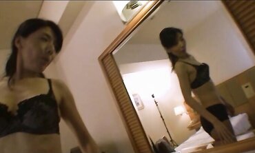 Accomplished Japanese with lengthy dark-hued hair Chiduru Tamiya humps with a young boy three