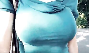Brunette Squeezes Cock in Blue T-shirt