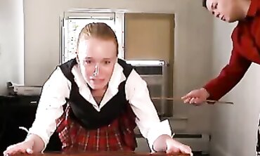 Strict Headmistress Delivers A Caning Punishment