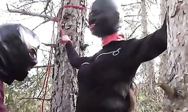 Hooded Latina Beauty Bound to Tree for Rough Outdoor Blowjob