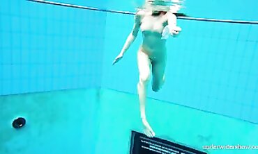 Nina Gets Hairy and Bare in an Underwater Scene