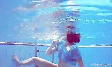 Barely Legal Redhead Marusia Swims Naked Underwater