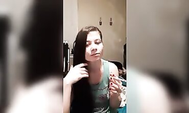 Joy Smokes and Plays with Her Hair in a Cute T-Shirt