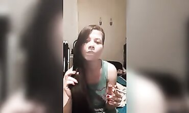 Joy Smokes and Plays with Her Hair in a Cute T-Shirt