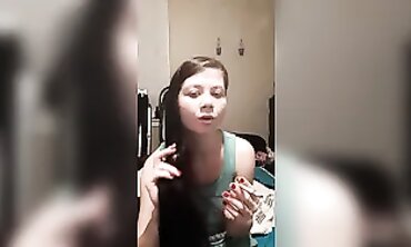 Joy Smokes and Plays with Her Hair in a Cute T-Shirt