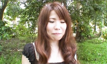 Pretty Chinese dark haired Rie Obata rubs her fur covered coochie with a wand two