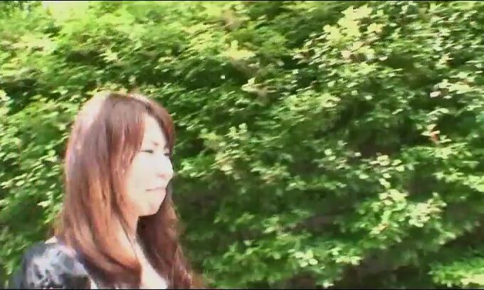 Pretty Chinese dark haired Rie Obata rubs her fur covered coochie with a wand two
