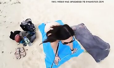 Leashed Brunette Dogged on the Beach