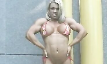 Fit Muscle Doll Struggles Into Her Bikini