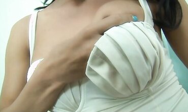 Coming from a soiree, a trans woman commences to fap her sausage and touch her ass fucking with fucktoys