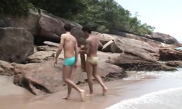 Twunk and beefy latino pummel rock hard on the beach.