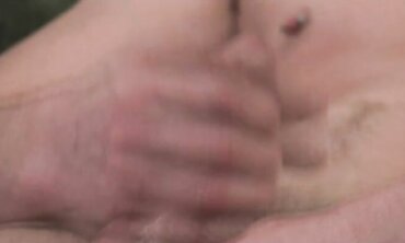 Guy with pierced nip and torso tat faps off and blows his fountain on his tummy.