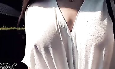 MILF Milky Shows Off Her Boobs In A White T-Shirt Outdoors