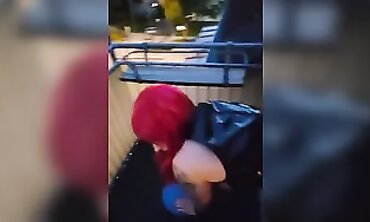 Redhead MILF Gives a Playful Blowjob at the Window