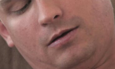 Smoothly-Shaven head guy with calf tat faps all over his stomach in his high rise bedroom.