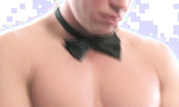 Stud with hard ripped build dressed in bow bind and g-wire, strokes himself on the sofa of his high rise guest room.