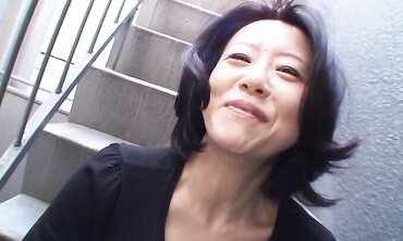 Japanese dark-haired Junko Sakashita got so aroused by a man that she flashed her globes on the street two
