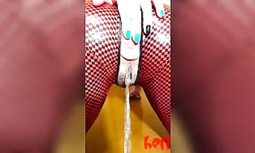 Solo Brunette in Tight Red Jumpsuit Pissing on the Floor