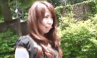 Pretty Japanese black-haired Rie Obata caresses her furry muff with a vibro two