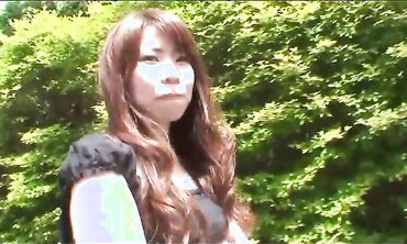 Pretty Japanese black-haired Rie Obata caresses her furry muff with a vibro two