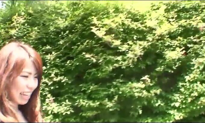 Pretty Japanese black-haired Rie Obata caresses her furry muff with a vibro two