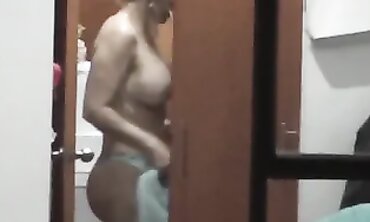 Blonde MILF in Lingerie Shows Off Big Tits and Ass by the Window