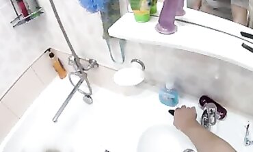 Petite Russian Babe Enjoys a Sensual Bathtub Session With Anal Plug