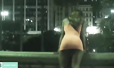 Dark-Haired Latina Flashing in City Traffic