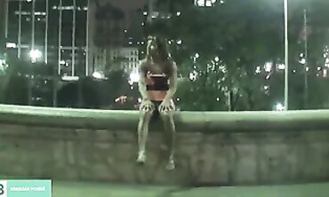 Dark-Haired Latina Flashing in City Traffic