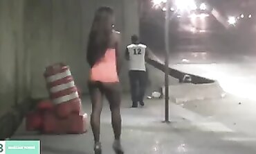 Dark-Haired Latina Flashing in City Traffic