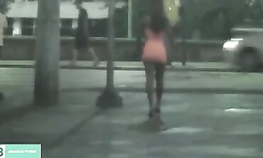 Dark-Haired Latina Flashing in City Traffic