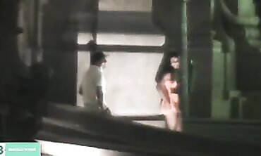Dark-Haired Latina Flashing in City Traffic