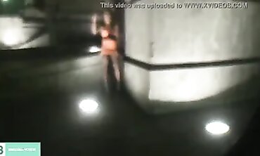 Dark-Haired Latina Flashing in City Traffic