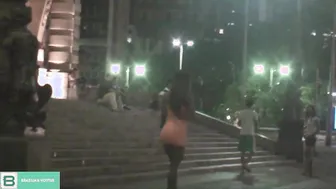 Dark-Haired Latina Flashing in City Traffic