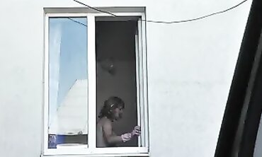 Russian Blonde Milf Washes Window Naked on Street
