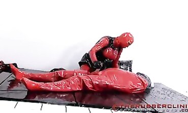 Red in Crimson Spandex Pissing on a Plinth Part 5