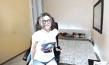 Solo Camgirl Teases Audience With Glasses and Pigtails
