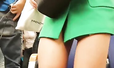 Candid Up-Skirt View of an Adorable Brunette